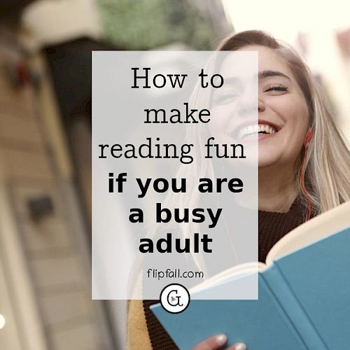 woman smiling while reading a book