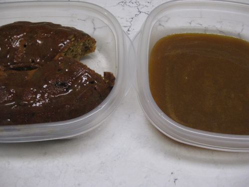 2 containers, one with sticky toffee pudding and the other with sauce