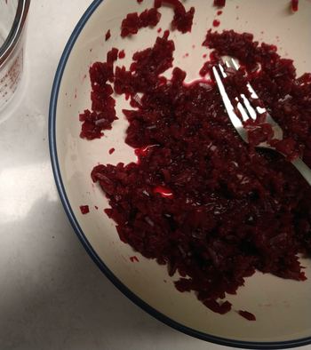 Shoestring beets after mashing with a potato masher and fork