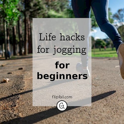 legs of person jogging through a park